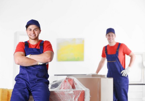 Professional home movers working on a Dalston residential street
