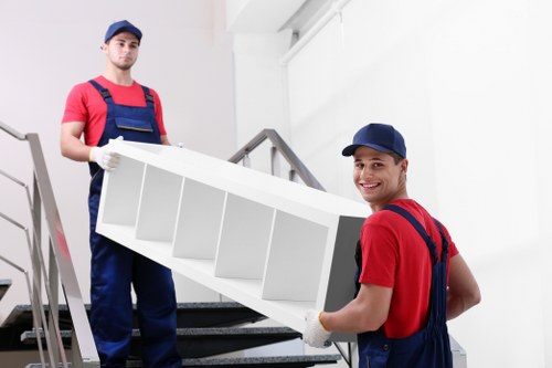 Loading furniture into a van on a Dalston street
