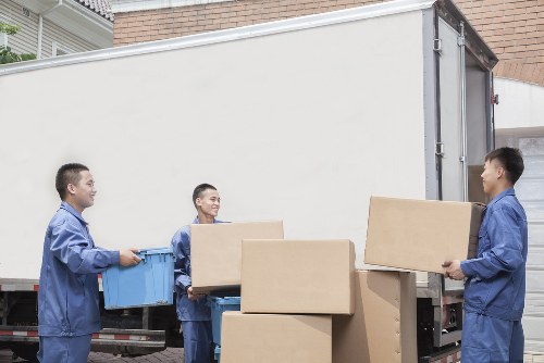 Removal van and moving team preparing a Dalston house move