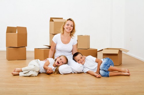Trained moving staff using PPE while loading furniture