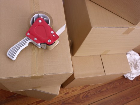 Professional movers handling furniture in a Dalston property